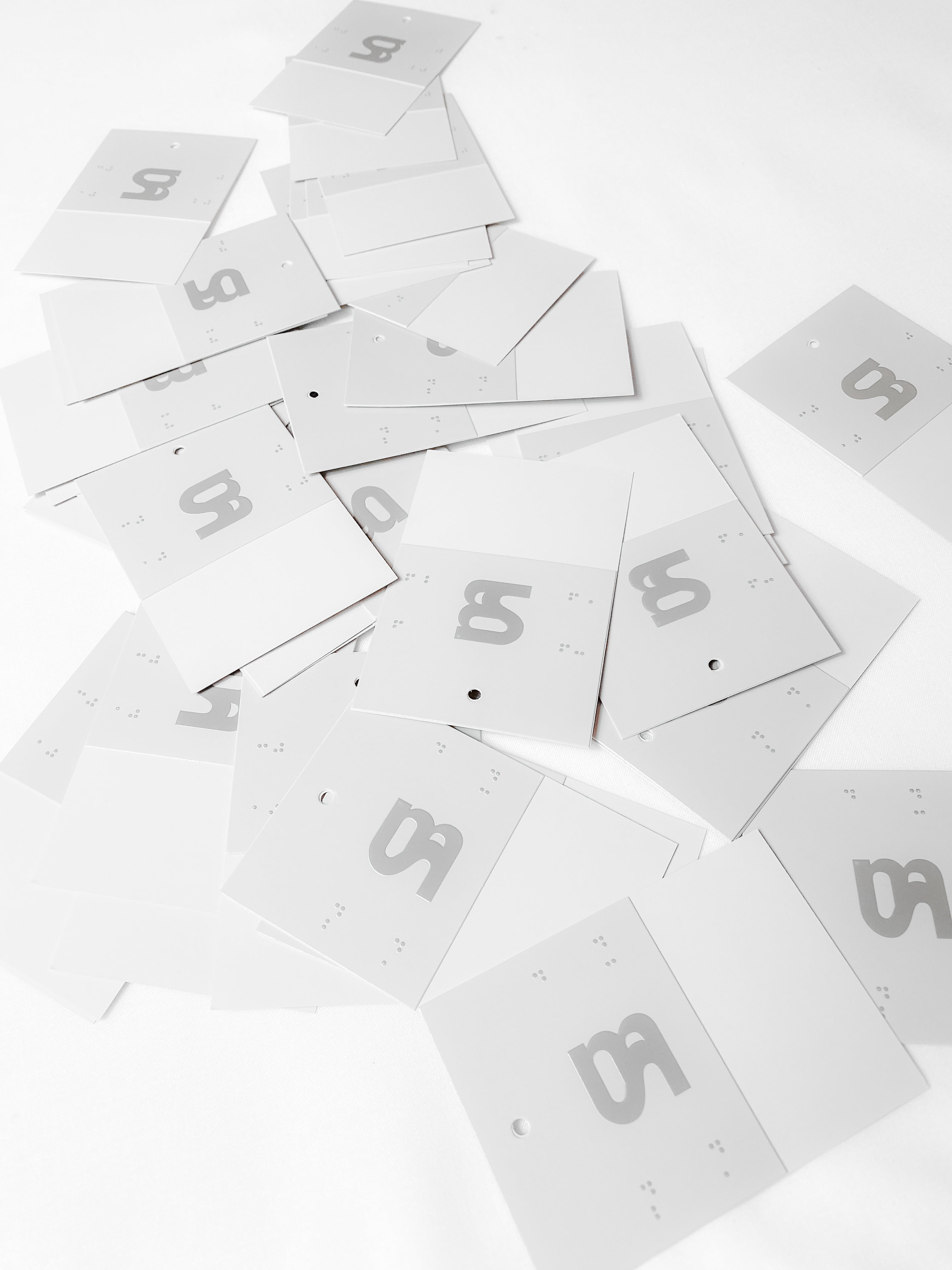Hangtags from Misela Studios in scattered position