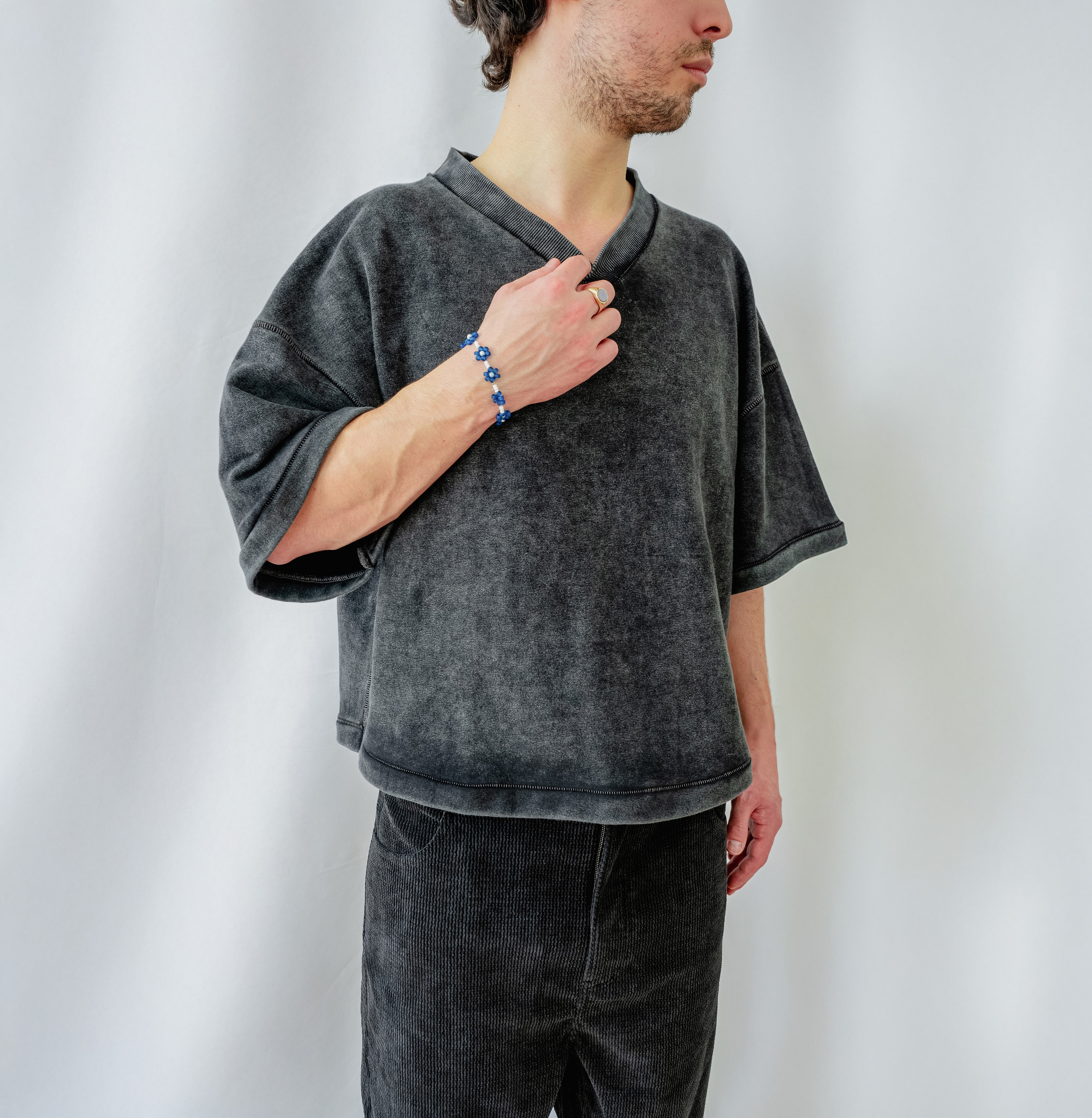 Cropped Baseball T-Shirt in Faded Black with V-Neck and Heavyweight Cotton - Frontview with Aesthetic hand