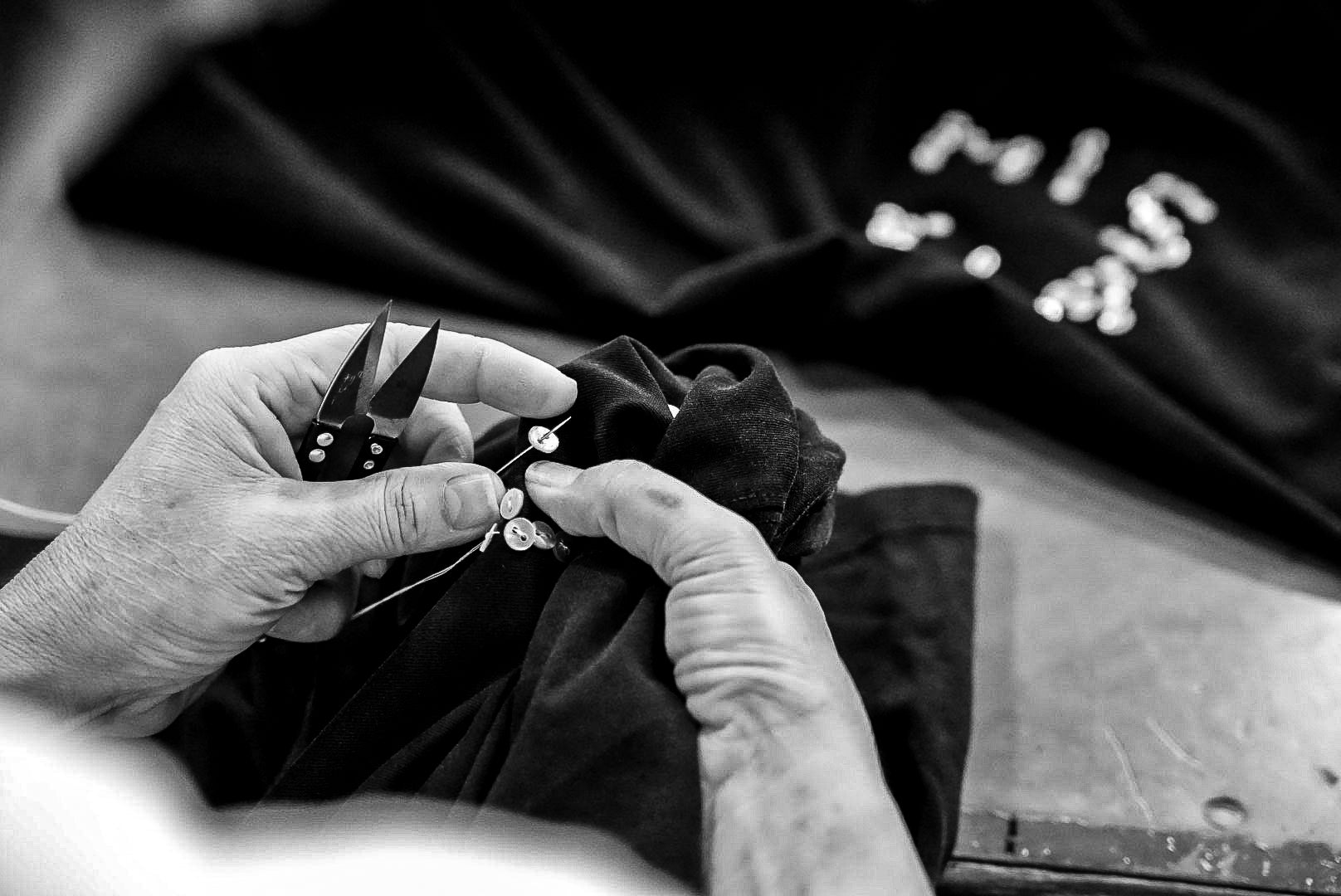 Person in point of view is sewing signature pearl tee from misela studios