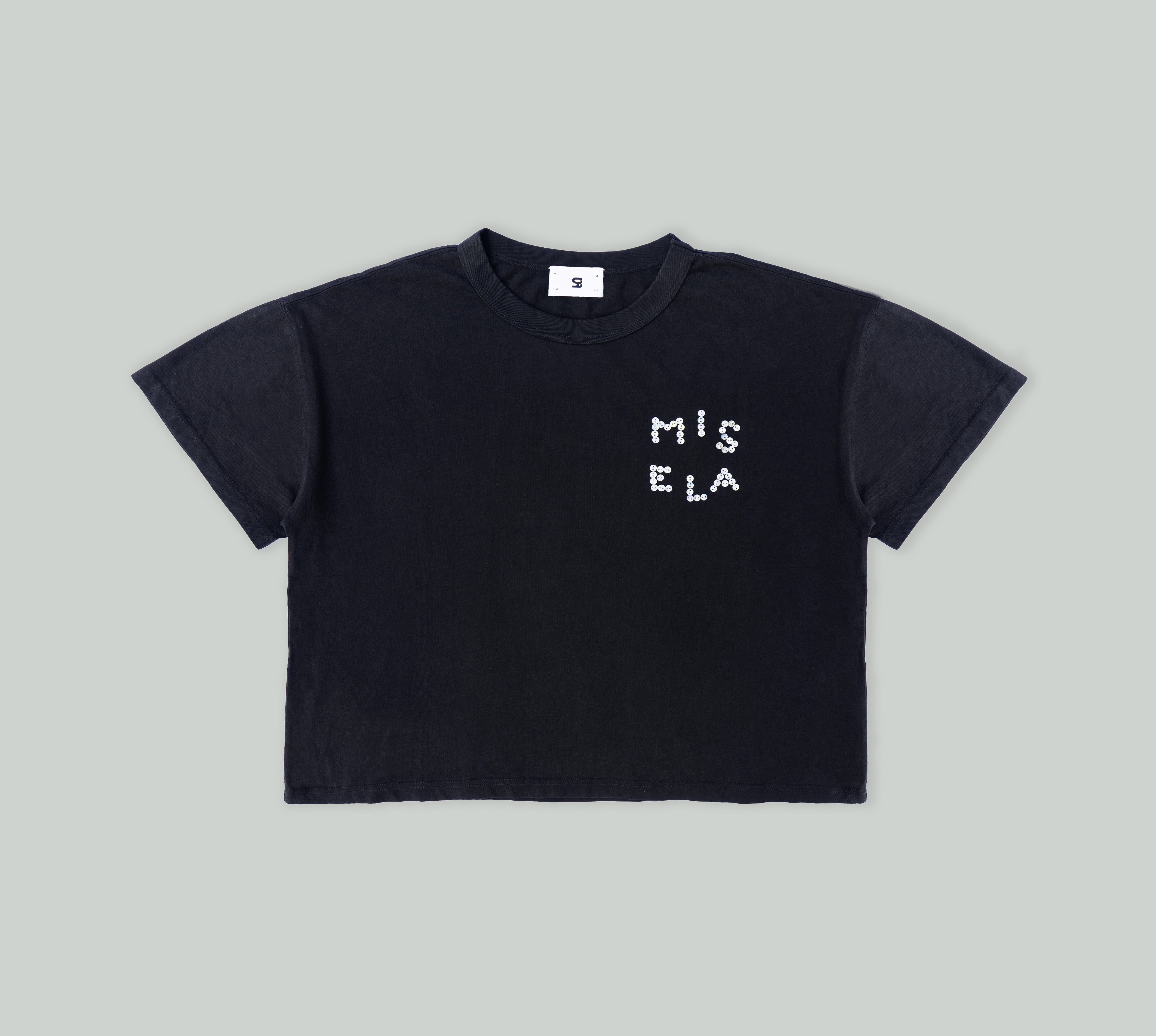 Signature Pearl Tee in Black from Misela Studios in front of a cloth screen - Frontview
