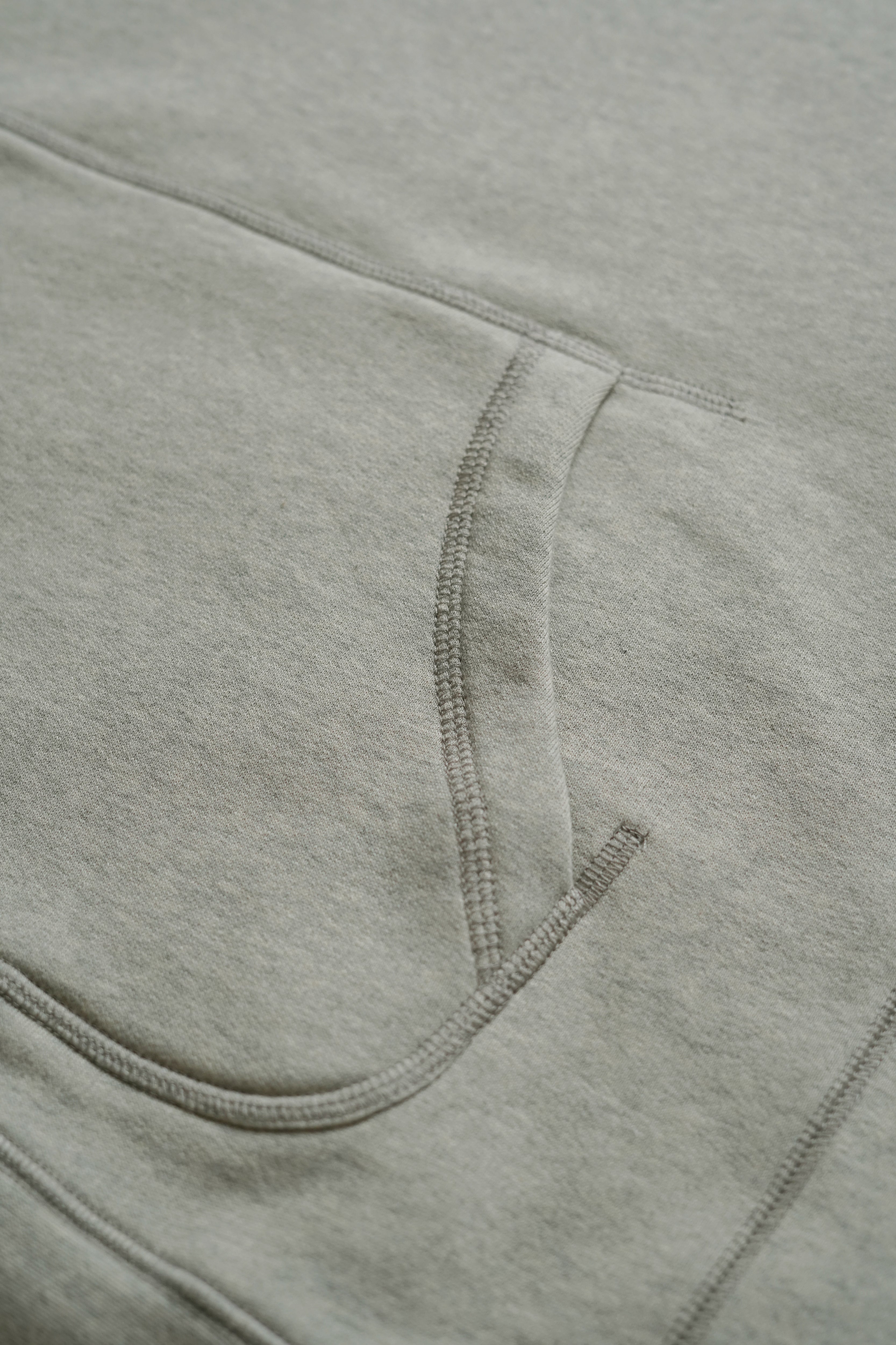 
Loose Fit Hoodie in Grey/Beige from Misela Studios with Hood and front pocket detail